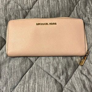Light pink, Michael Kors wallet. Signs of normal wear and tear.